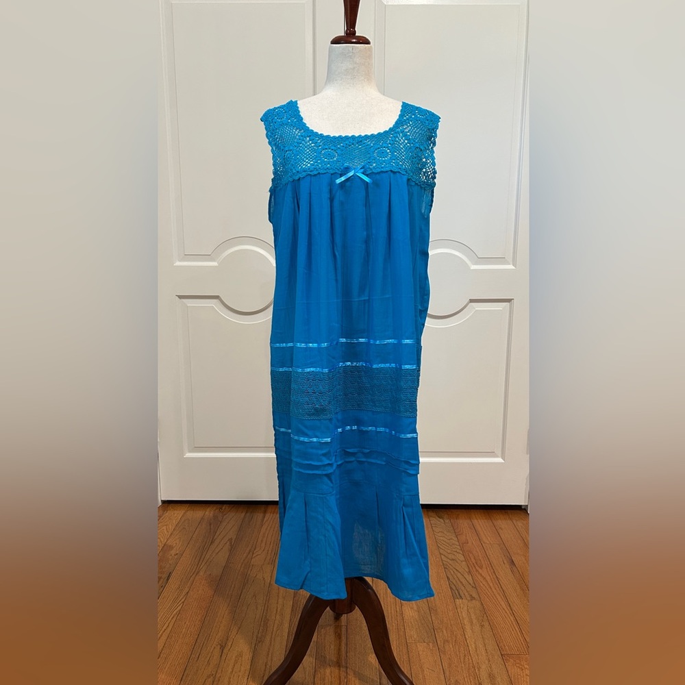 Artisanal Mexican women’s  summer dress is made with crochet and cotton manta.